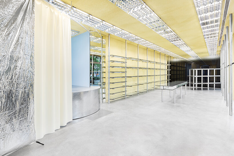 metallic meets vibrant blue inside modes milan's store design by gonzalez haase AAS