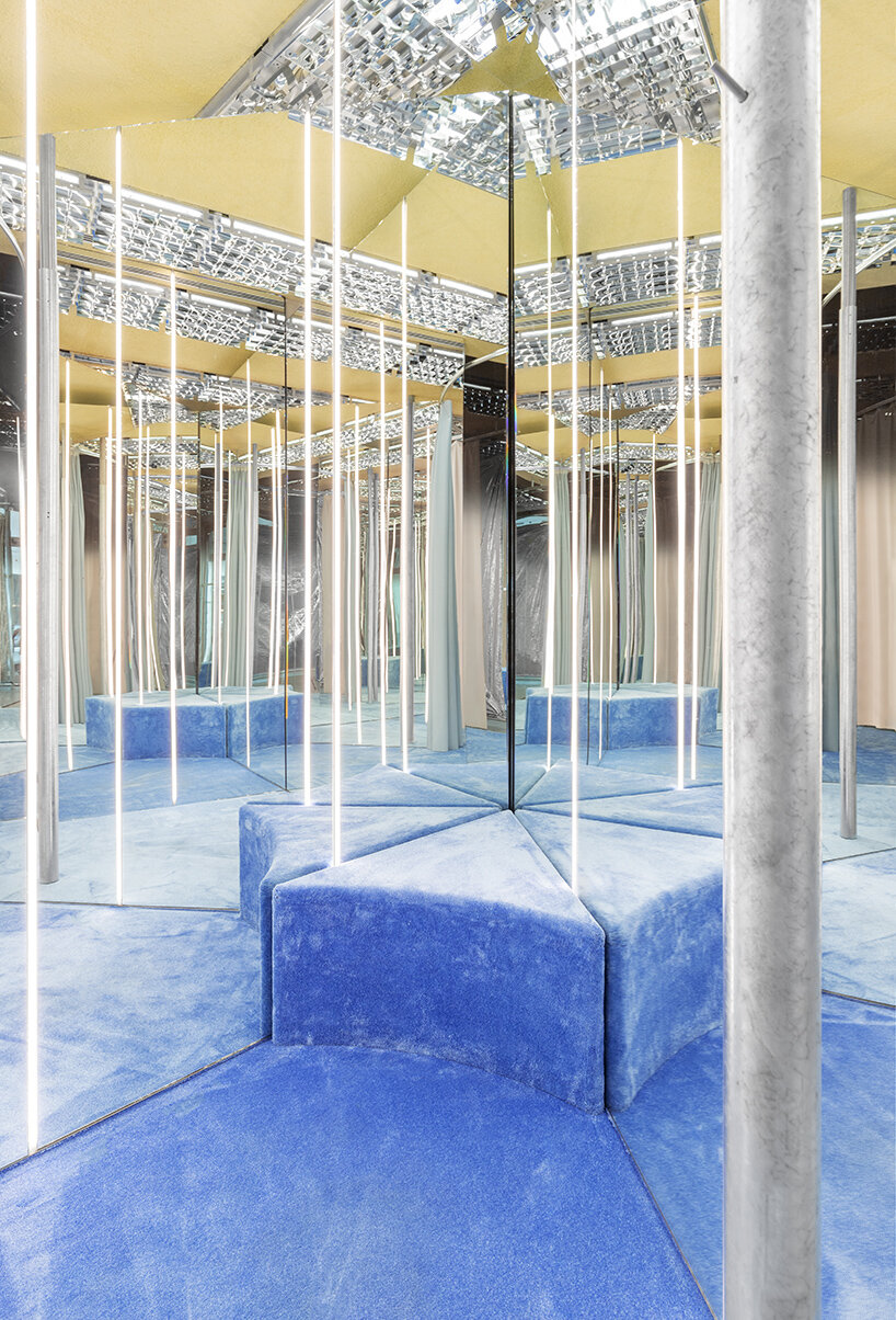 metallic meets vibrant blue inside modes milan's store design by gonzalez haase AAS