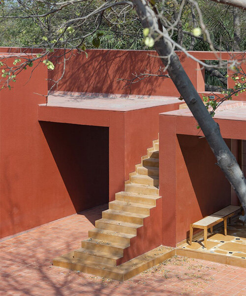 a cluster of open spaces and verandahs woven with nature shape this home in india