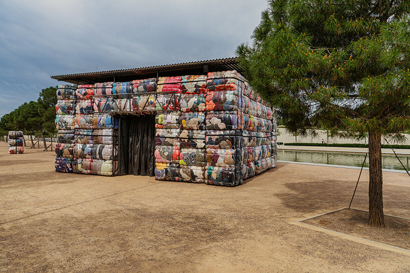 the nest collective's outdoor installation in athens evokes a dystopian waste landscape