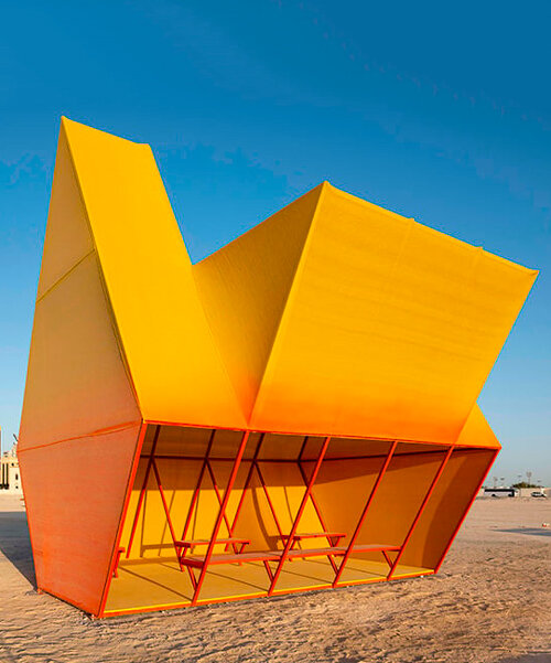 colorful angular volumes shape resting bleachers for cricket players in qatar