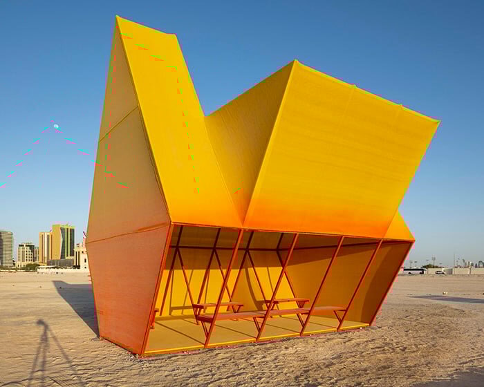 colorful angular volumes shape resting bleachers for cricket players in qatar