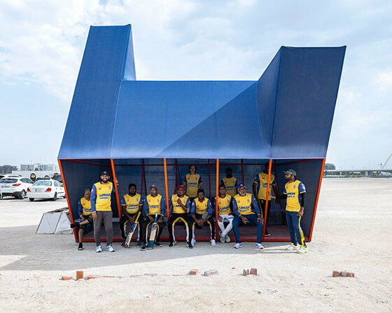 colorful angular volumes shape resting bleachers for cricket players in qatar