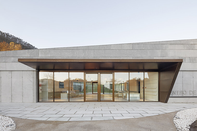 a folded stone roof crowns this visitor center in the spanish hillside