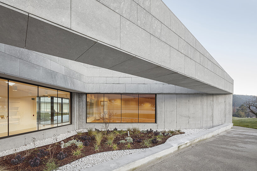 a folded stone roof crowns this visitor center in the spanish hillside
