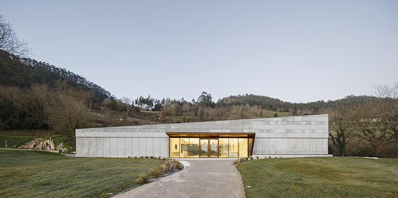 a folded stone roof crowns this visitor center in the spanish hillside