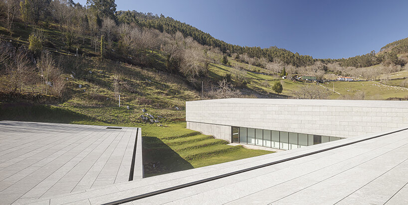 a folded stone roof crowns this visitor center in the spanish hillside