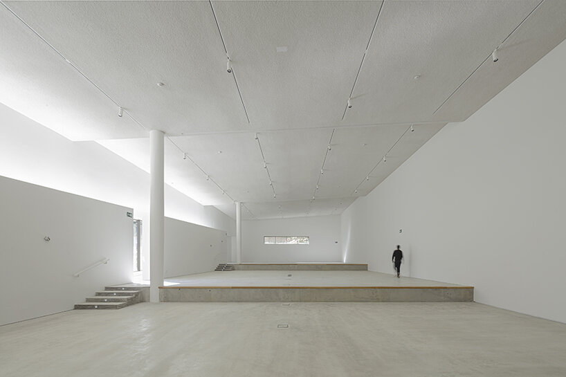 a folded stone roof crowns this visitor center in the spanish hillside