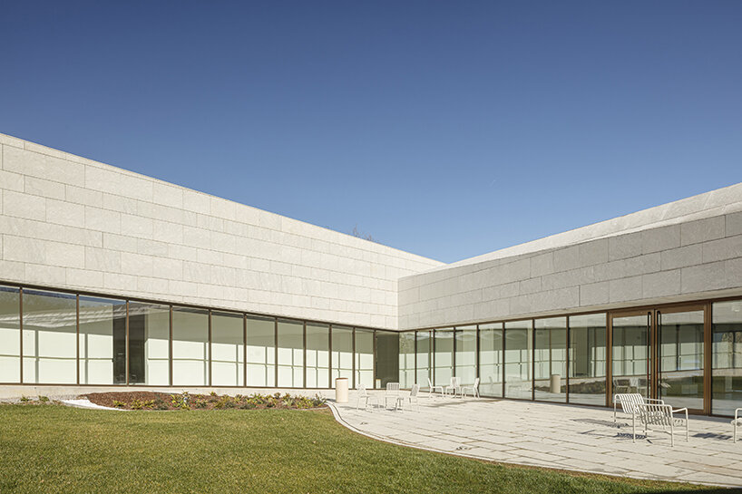 a folded stone roof crowns this visitor center in the spanish hillside
