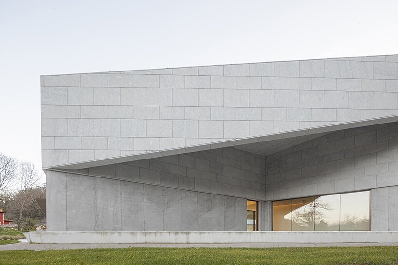 a folded stone roof crowns this visitor center in the spanish hillside
