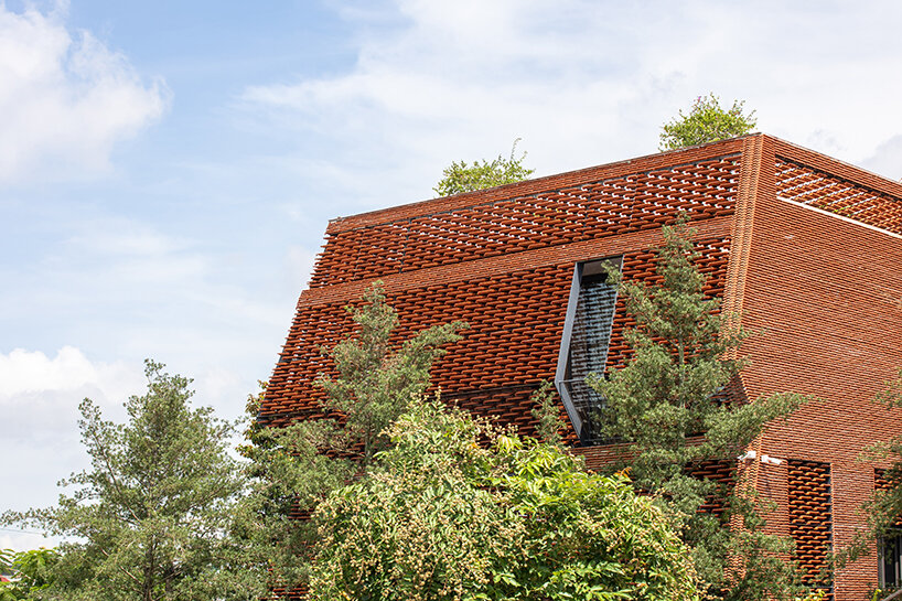 H&P architects' latest clay tile structure unfolds as a nature-infused dwelling in vietnam