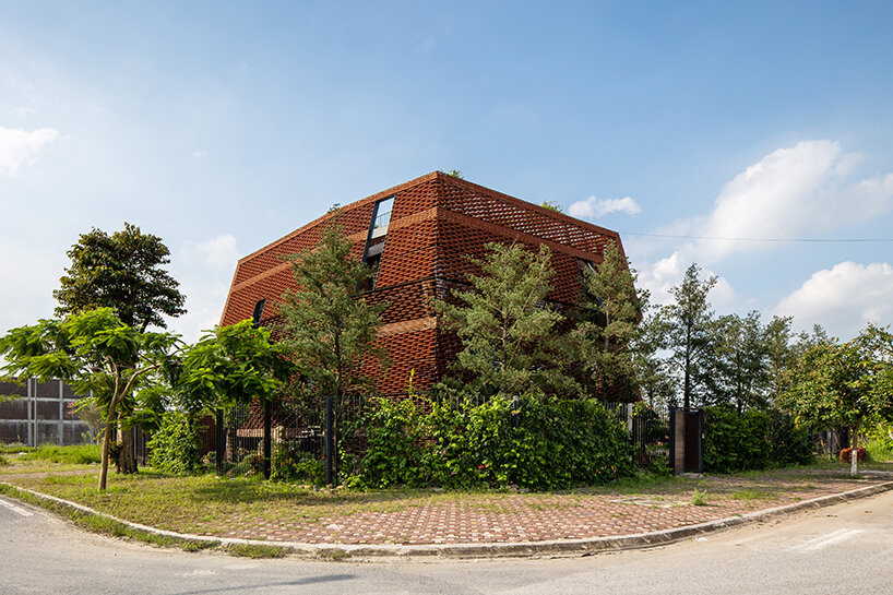 H&P architects' latest clay tile structure unfolds as a nature-infused dwelling in vietnam