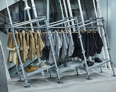 sloped scaffolding displays in tokyo showcase inclusive apparel range by new balance