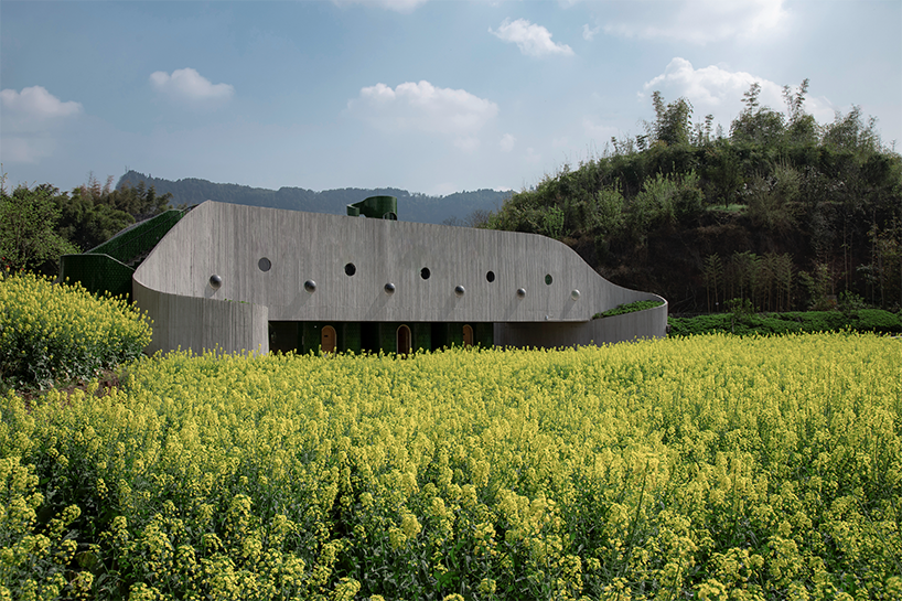 folded agricultural complex doubles as bridge and public toilet in rural china