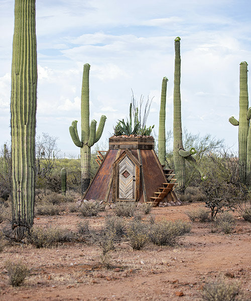 a tiny cabin is shaped by repurposed steel and saguaro bones in the sonoran desert