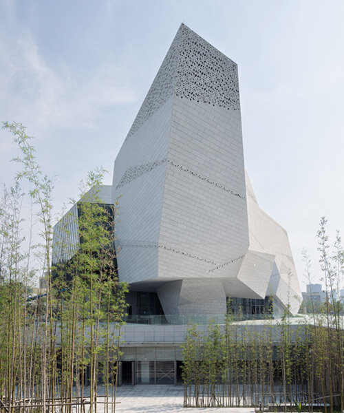 chengdu museum of natural history resembles a monolithic landform of perforated granite