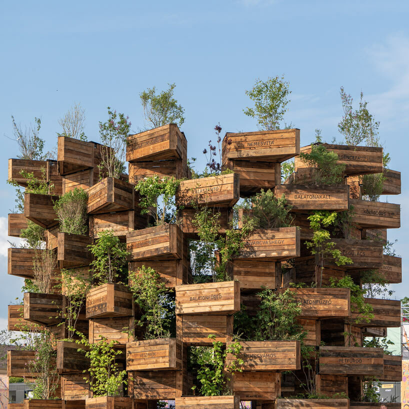 hello wood stacks triangular lush planters for the garden of communities installation