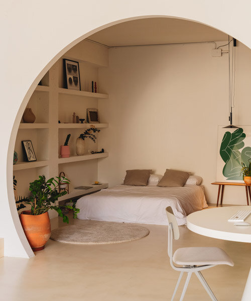 isern serra frames an artist's loft with circular portals in barcelona