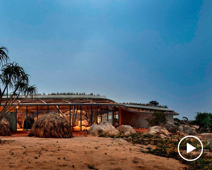 undulating cultural center nestles along a granite ridge in south africa