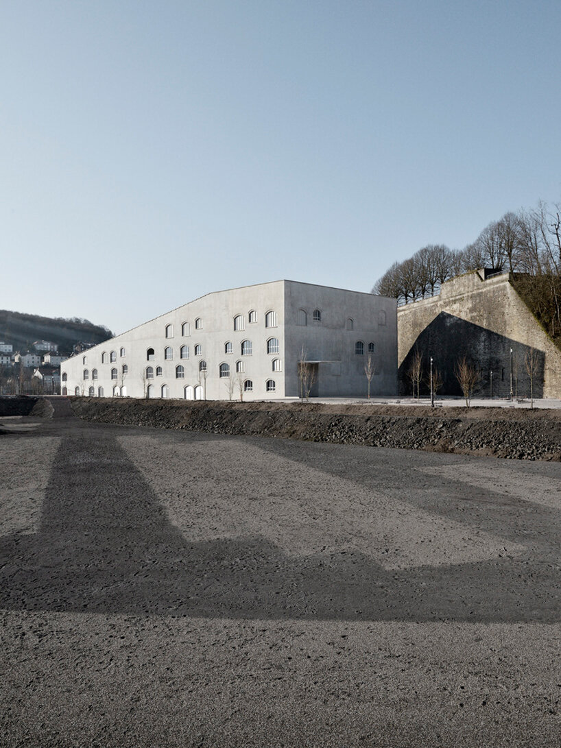 hybrid cultural center by K architectures opens dramatic concrete arcades in france