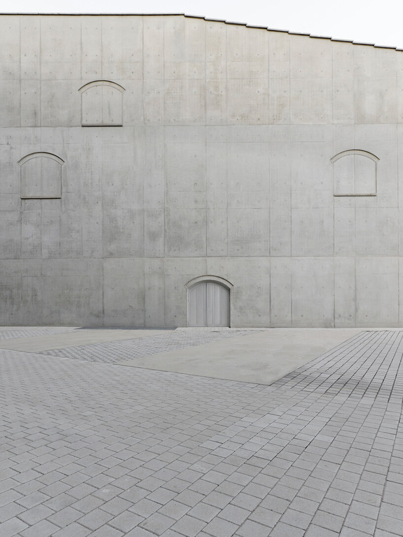 hybrid cultural center by K architectures opens dramatic concrete arcades in france