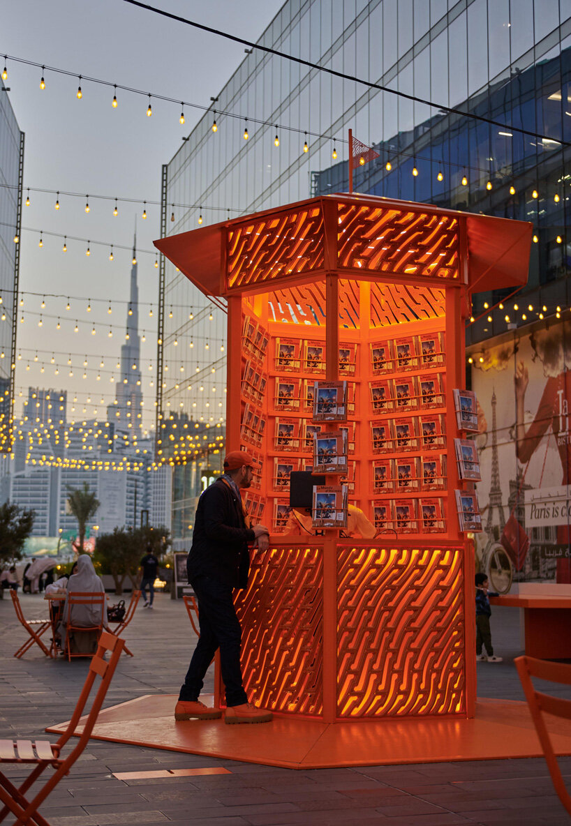 MEAN* wraps traveling hermès pop-up in vivid orange 3D-printed tessellation