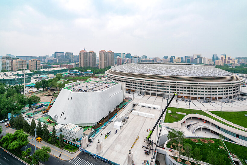sheer white, fluid facade envelops MAD architects' near-complete concert hall in beijing