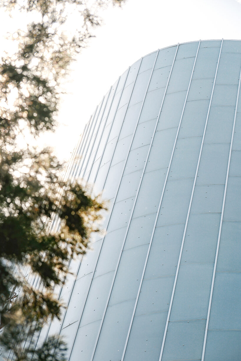sheer white, fluid facade envelops MAD architects' near-complete concert hall in beijing