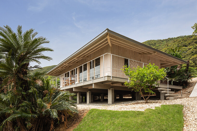 on a secluded japanese hill, ryosuke ono nestles a stilted rental villa with a panoramic porch
