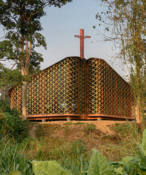intricate timber latticework envelops st francis oratory amidst thailand's serene landscapes