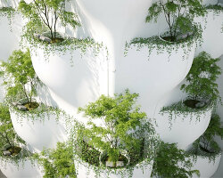 SAVA envisions beauty spa facade in vietnam as stacks of sculptural tree planters