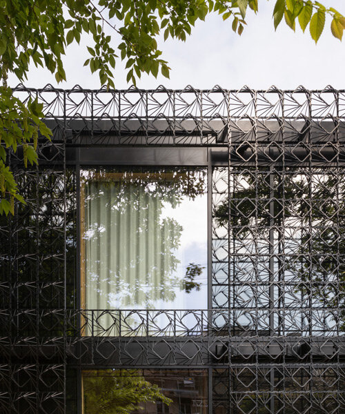 an intricate facade of 'woven' steel promotes a picturesque climbing garden in england