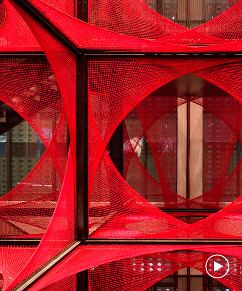 150,000 meters of vibrant red brocade threads compose immersive installation in china