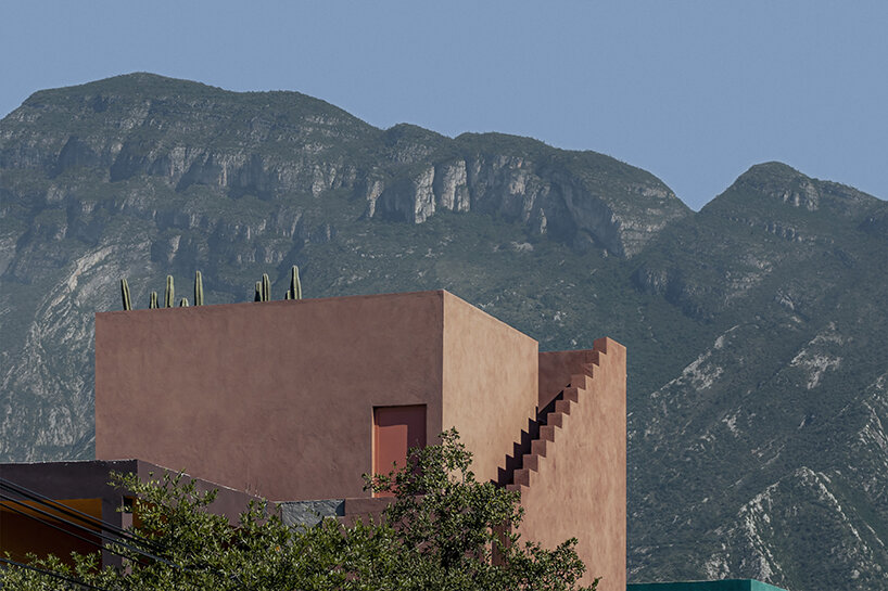 all-red casa ederlezi in mexico pairs bold volumetry with mediterranean tones