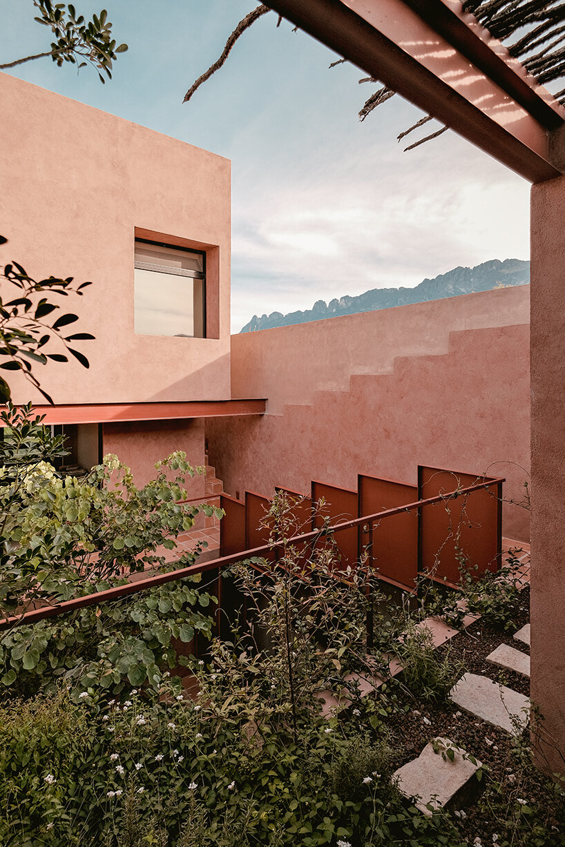 all-red casa ederlezi in mexico pairs bold volumetry with mediterranean tones