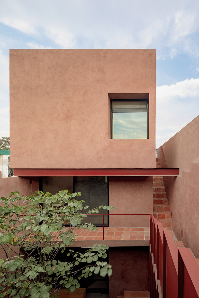all-red casa ederlezi in mexico pairs bold volumetry with mediterranean tones