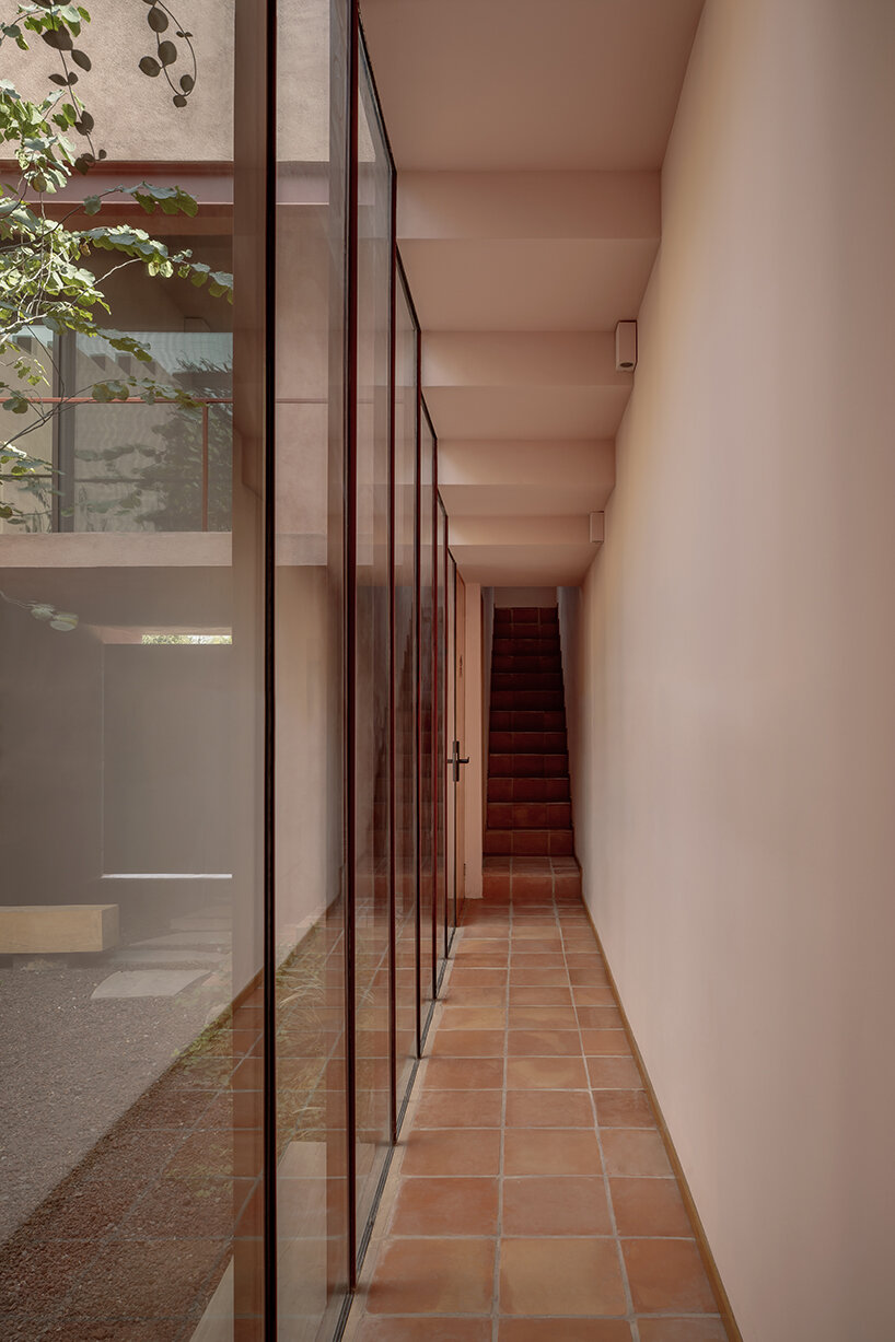 all-red casa ederlezi in mexico pairs bold volumetry with mediterranean tones