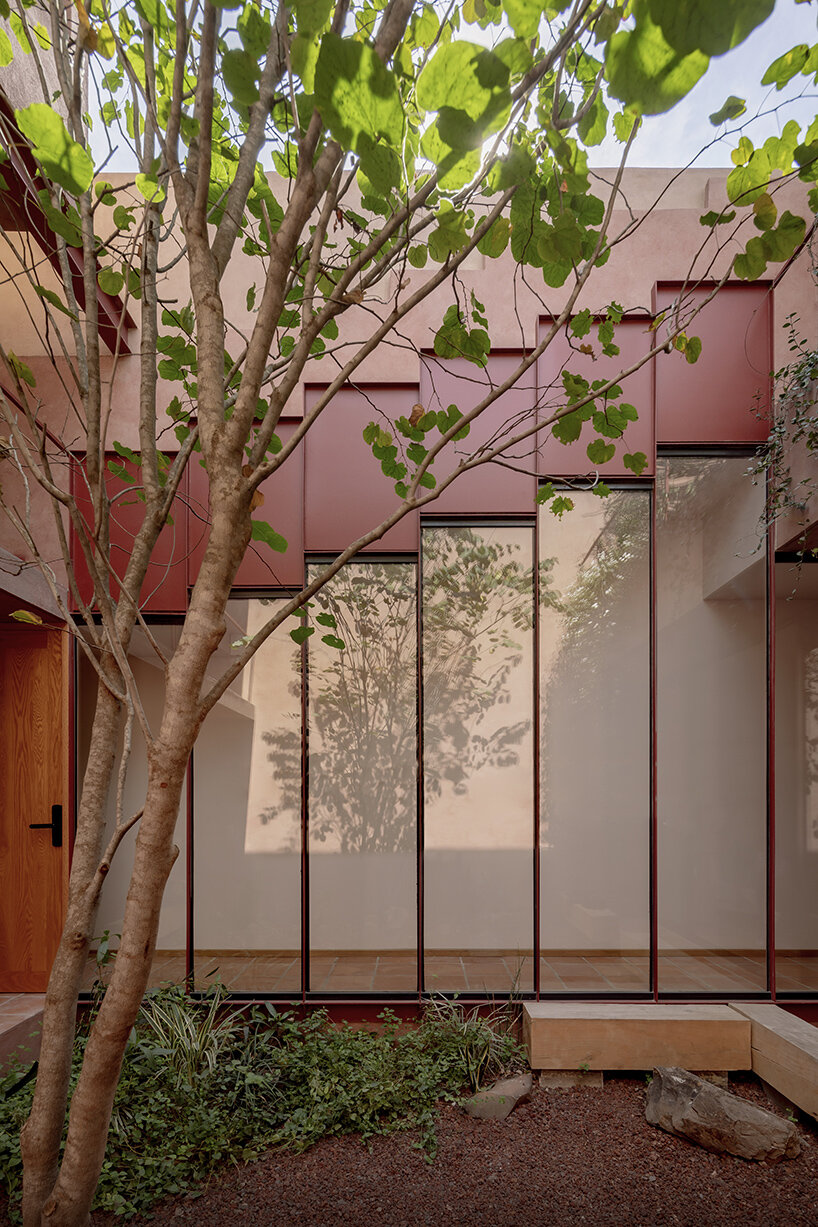 all-red casa ederlezi in mexico pairs bold volumetry with mediterranean tones