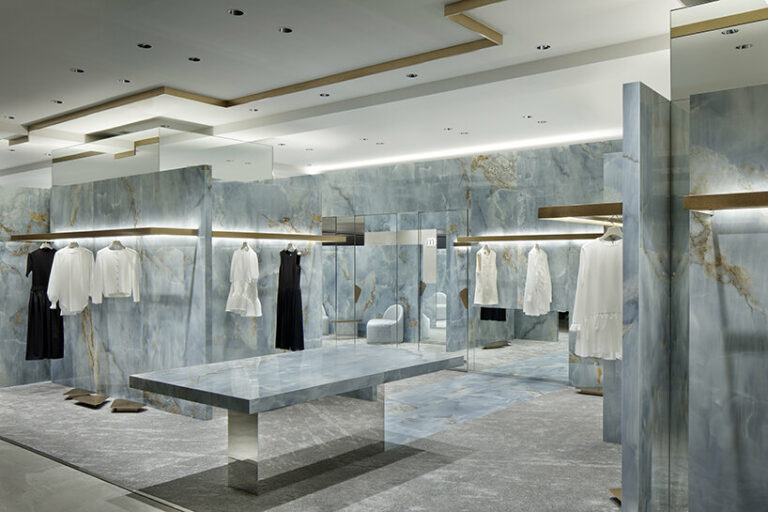 blue onyx slabs unfold within curiosity's m-i-d store design in kobe