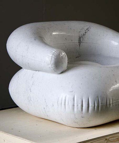 sculpture hand-carved from 600 kg of carrara marble emulates a plastic inflatable chair
