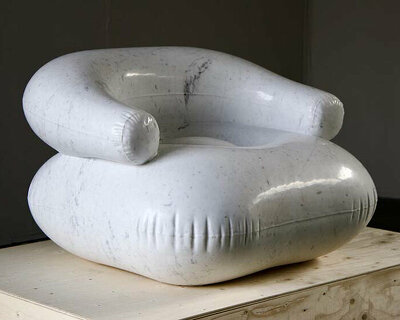 sculpture hand-carved from 600 kg of carrara marble emulates a plastic inflatable chair