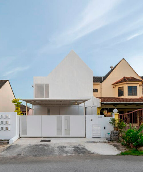 white-washed outer shell enfolds renovated insight house in kuala lumpur