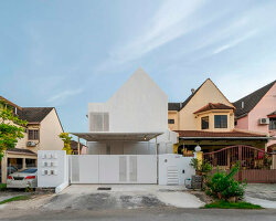 white-washed outer shell enfolds renovated insight house in kuala lumpur
