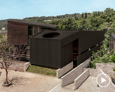 dark monolithic angular volumes shape jae haala villa in indonesia