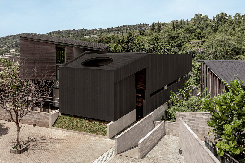 dark monolithic angular volumes shape jae haala villa in indonesia