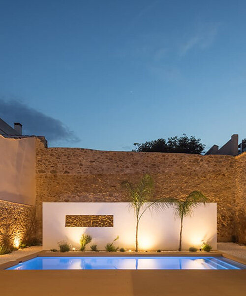 jsj arquitectos revives century-old stone walls to create luminous modern home in spain 