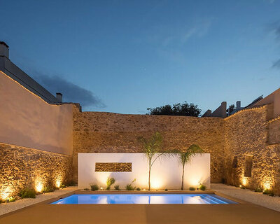 jsj arquitectos revives century-old stone walls to create luminous modern home in spain