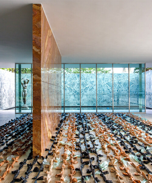 endless plastic bags fill mies van der rohe's barcelona pavilion to spotlight the cost of money