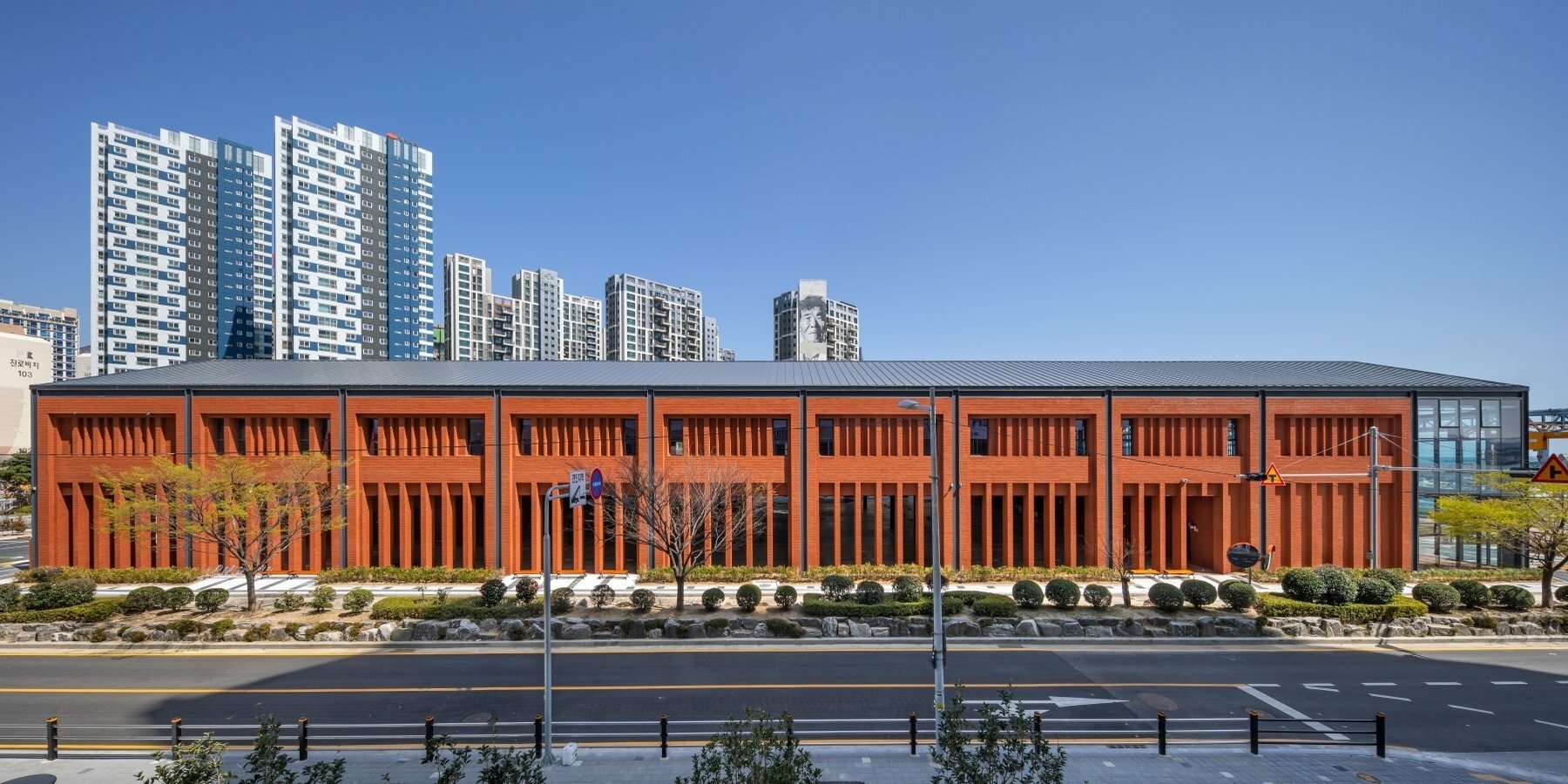 red brick and steel framework composes millac the market in south korea