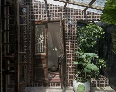 limdim studio brings modern design to vietnamese alley house with ngâu restoration